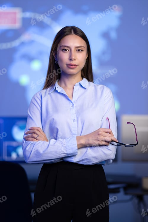 Preview: Confident female Cybersecurity Analyst or Manager in large Cyber Security Operations Center SOC