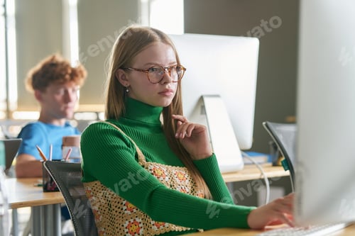 Preview: Student studying on computer at class