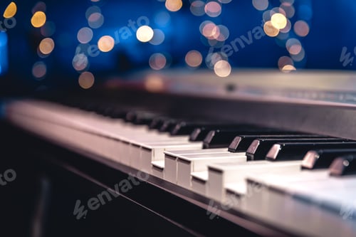 Preview: Piano keys close-up on a blurred background with bokeh.