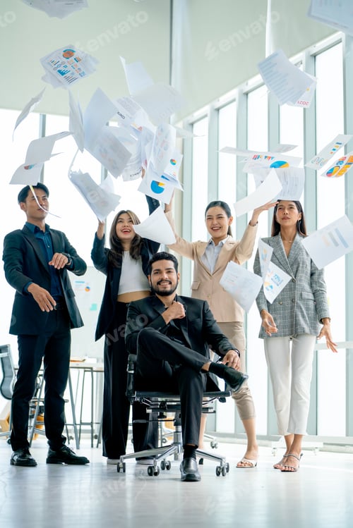 Preview: Vertical image of Asian business man and woman throw several paper up over the manager sit on chair