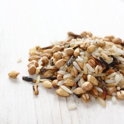 Preview: Pile of uncooked multigrain rice on white wooden background