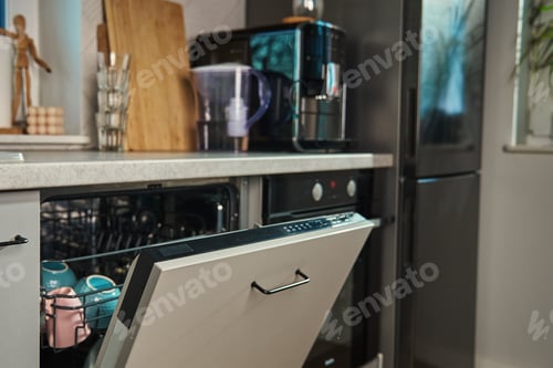 Preview: Open dishwasher with clean dishes in modern kitchen