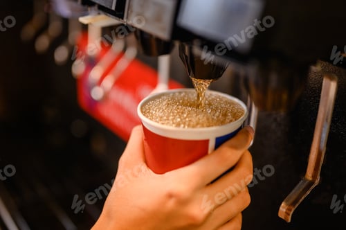 Preview: man pours a fizzy drink.sparkling water.cool ice soft drink cola