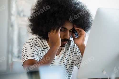 Preview: Tired man with eyes closed at office