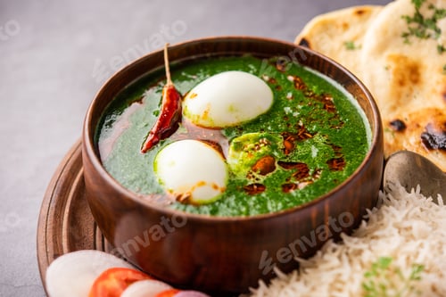 Preview: Spinach egg curry is an Indian non vegetarian dish made using palak gravy with eggs