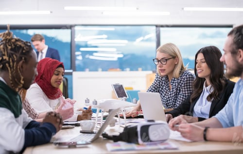 Preview: multiethnic business team learning about drone technology