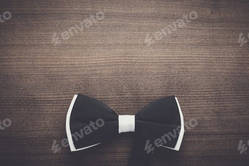 Preview: Elegant Black Bow Tie on Wood Background