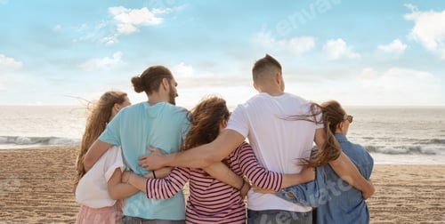 Preview: Friends enjoying a sunset view at the beach while embracing each other