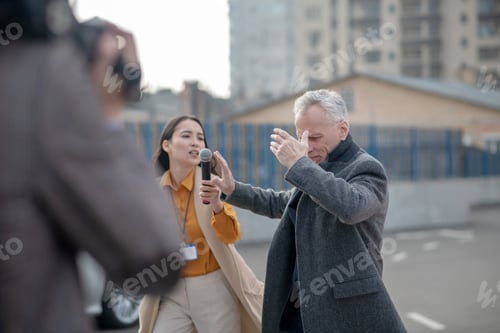 Preview: Reporters meeting famous businessman next to his office