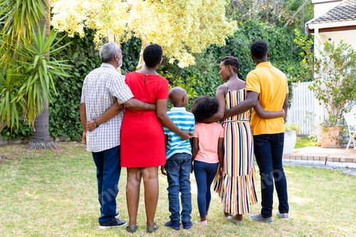 Preview: Three generation African American family spending time together in their garden.