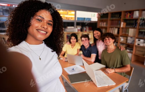 Preview: Cheerful selfie of a group of friends in a library gathered to study together after class.