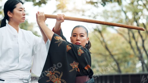 Preview: Instructor, bamboo sword and Asian woman for martial arts, Kendo practice and exercise. Culture, he