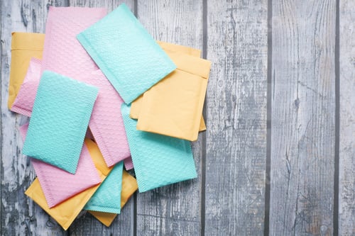 Preview: colorful paper bubble envelope on table