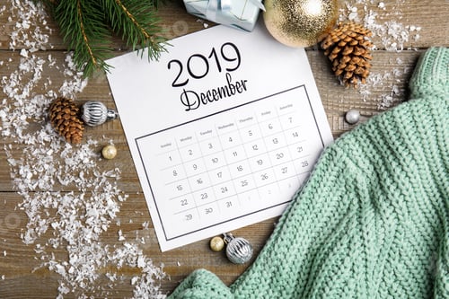 Preview: Flat lay composition with paper calendar on wooden table