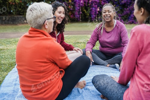 Preview: Women Sitting Together and Laughing in a Park