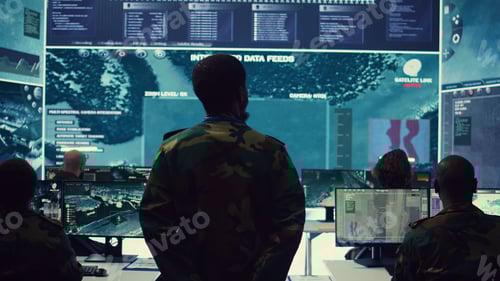 Preview: Soldiers Monitoring Data on Large Computer Screens
