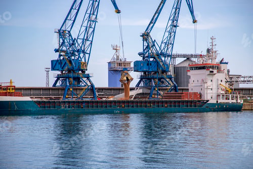 Preview: Cranes Loading Grain into a Large Cargo Ship