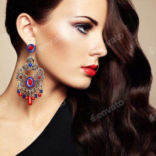 Beautiful Woman with Glamorous Makeup and Jewelry