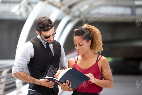 Preview: Business People Discussing While Standing On Footbridge, young businesspeople walk together outdoor.