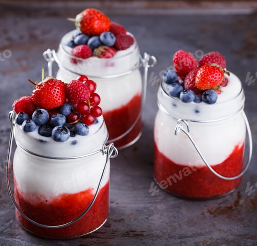 Preview: Yogurt,homemade,with fresh berries, berry puree in a glass container.Healthy eating.