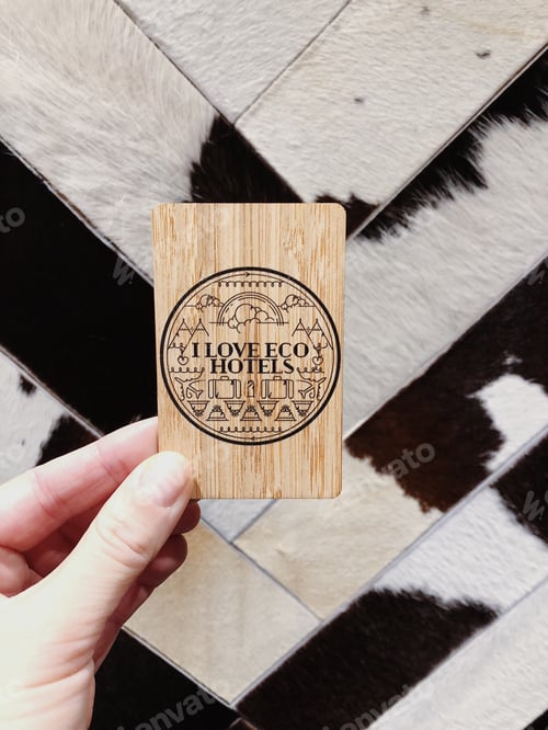 Preview: Hand holding eco wooden hotel room card
