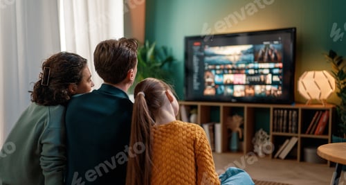 Preview: family watching TV at home