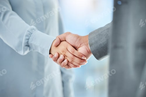 Preview: Cropped shot of two unrecognizable businesspeople shaking hands in an office