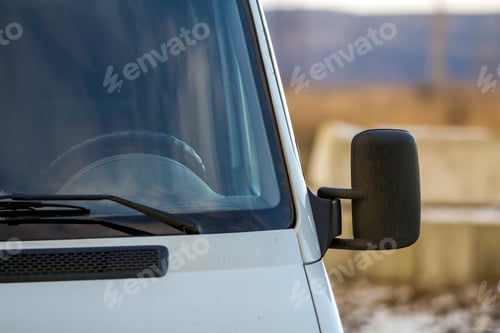 Preview: Close up of side rear-view mirror on a modern car