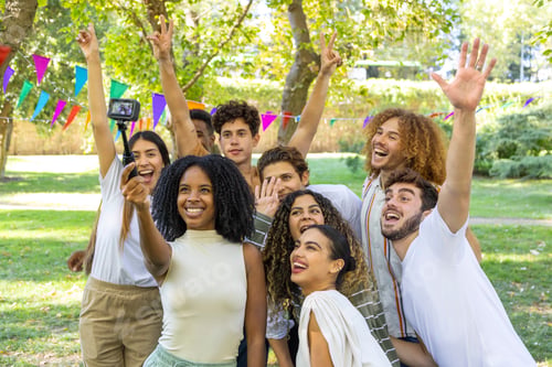 Preview: Group of friends taking selfie in park with action camera