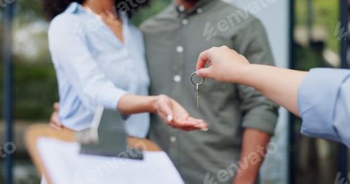 Preview: Couple, hands and realtor with key to new home with property investment, mortgage success and contr
