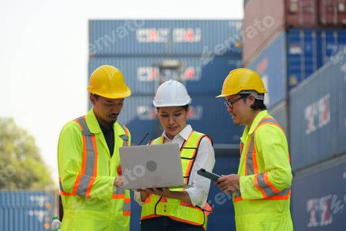 Preview: Foreman control loading Containers box from Cargo freight ship for import export.