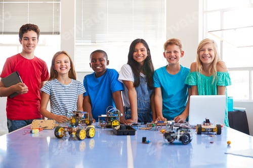 Preview: Portrait Of Male And Female Students Building Robot Vehicle In After School Computer Coding Class