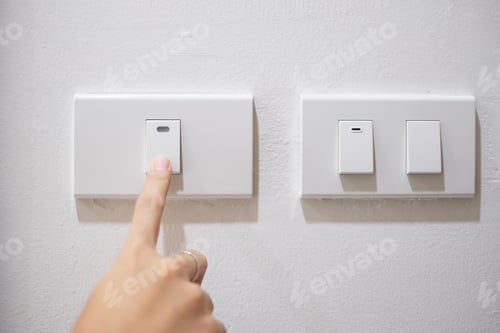 Preview: turn on or off on light switch on white wall at home