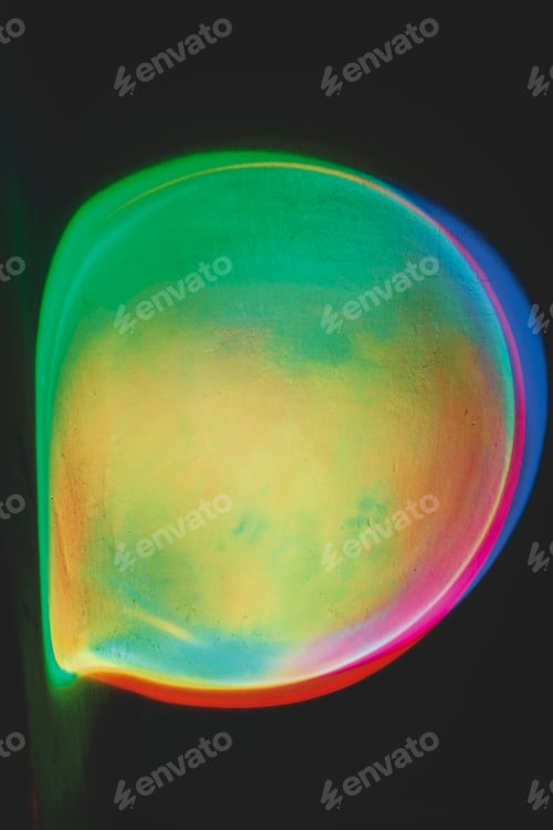 Preview: Abstract image of colorful shapes of light against black background