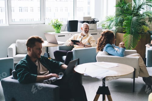 Preview: experienced entrepreneurs developing project via modern devices