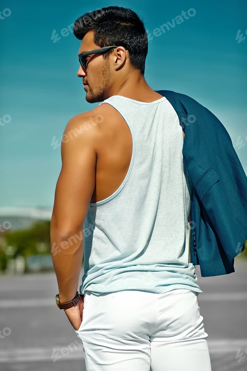 Preview: Portrait of young handsome man posing in the street
