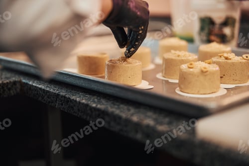 Preview: Talented confectioner adding finishing touches to delicious desserts