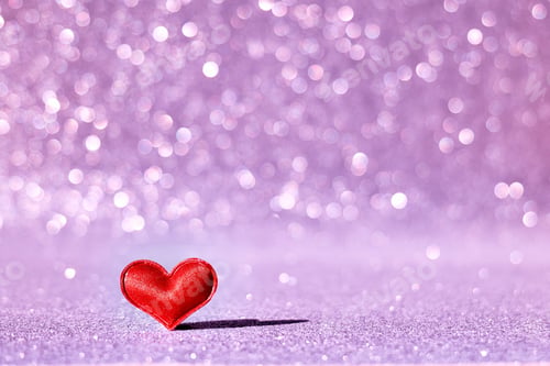 Preview: Red heart on a lilac blurred abstract background with bokeh. Valentine's day concept. Greeting card.