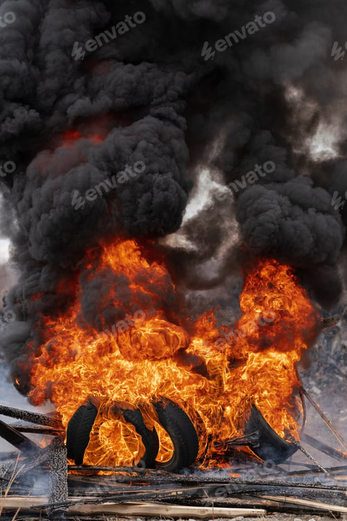 Preview: Burning Cars Tires, Flame of Red-Orange Fire and Clouds of Black Smoke in Sky