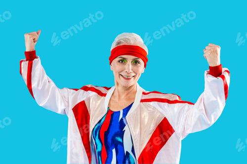 Preview: Happy and funny senior old woman on colorful background