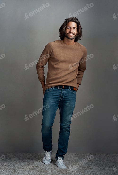 Preview: Studio shot of a handsome young man posing against a gray background