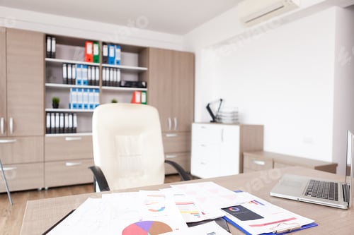 Preview: Table full of pappers in modern empty office