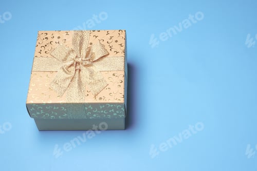 Preview: Top view of gift box on blue background. Free space for text