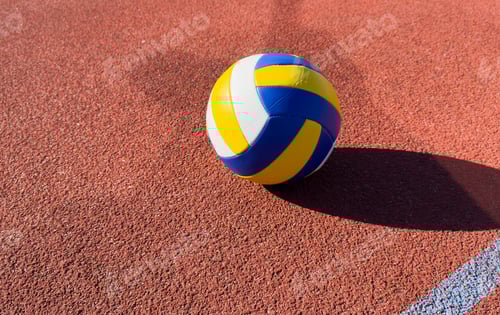 Preview: volleyball ball on outdoor court.