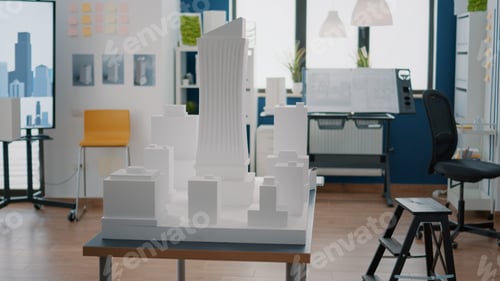 Preview: Empty architectural space with buidling model and maquette to create property plan on desk