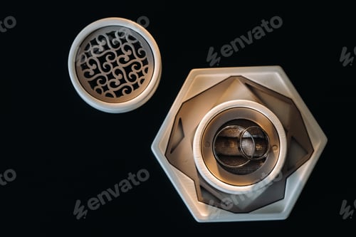 Preview: two gold wedding rings in a white box on a black background