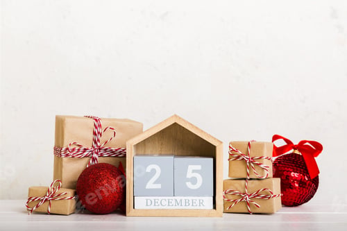 Preview: 25 december. Christmas composition on colored background with a wooden calendar