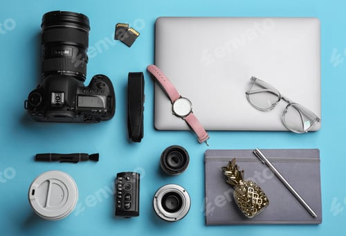 Preview: Flat lay composition with photographer's equipment and accessories on color background