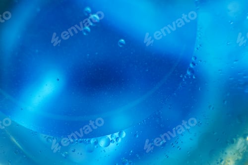 Preview: Oil bubbles close up. circles of water macro. abstract light blue background