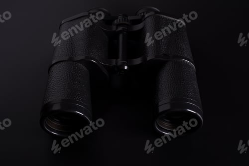 Preview: binoculars on a black background
